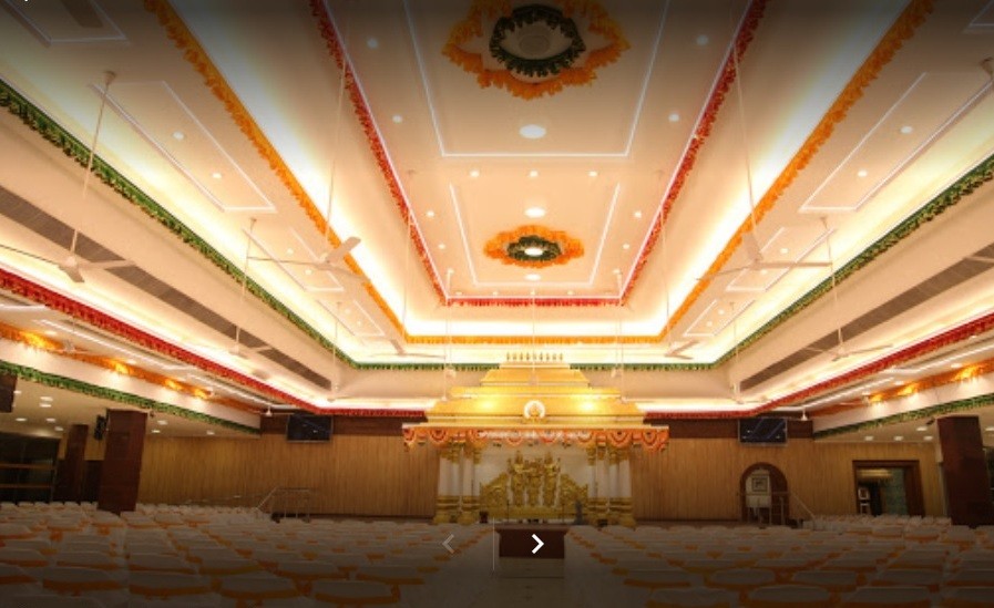 Spacious air-conditioned main hall with decorative ceiling lighting and seating arrangement