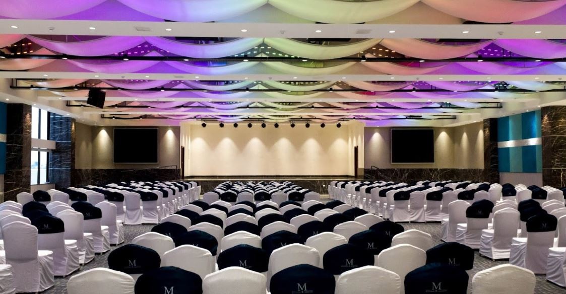 Wings Convention Centre, Vanagaram — grand illuminated hall stage and seating